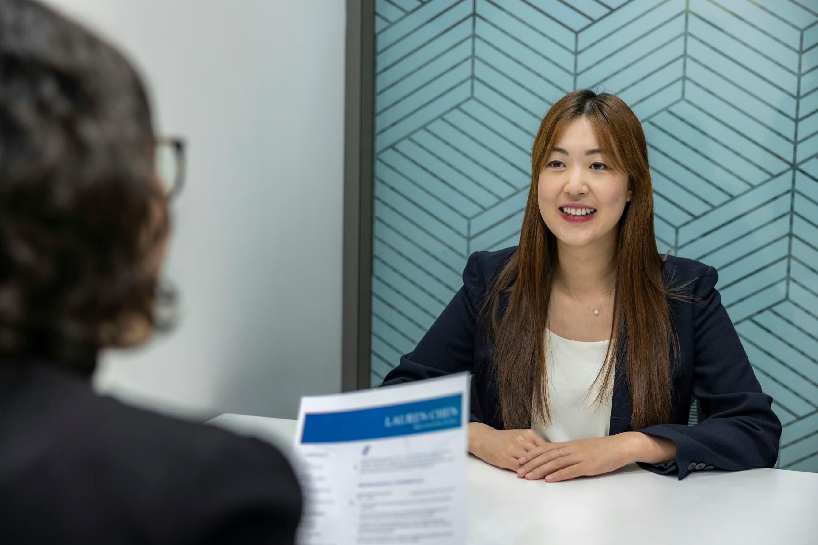 A professional conversation in a warmly lit office